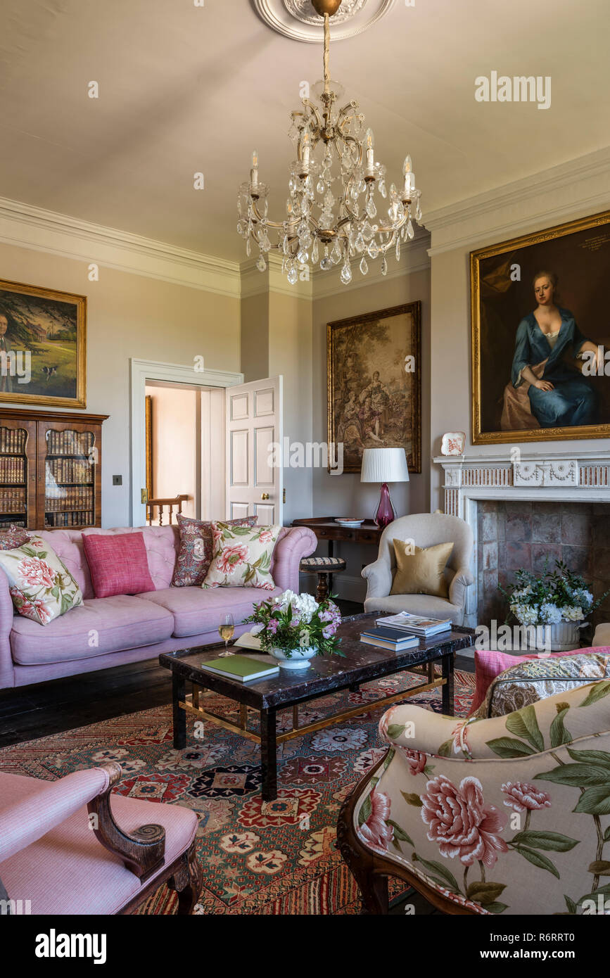 18th century Goodnestone estate Portrait of Fanny Fowler above fireplace in drawing room with pink sofa in 18th century Goodnestone mansion Stock Photo