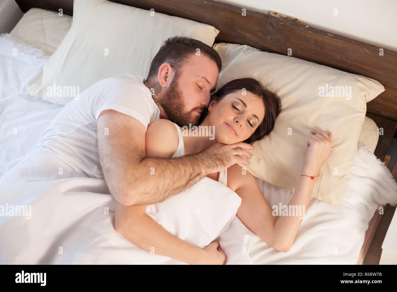 husband and wife wake up in the morning in the bedroom of the ...