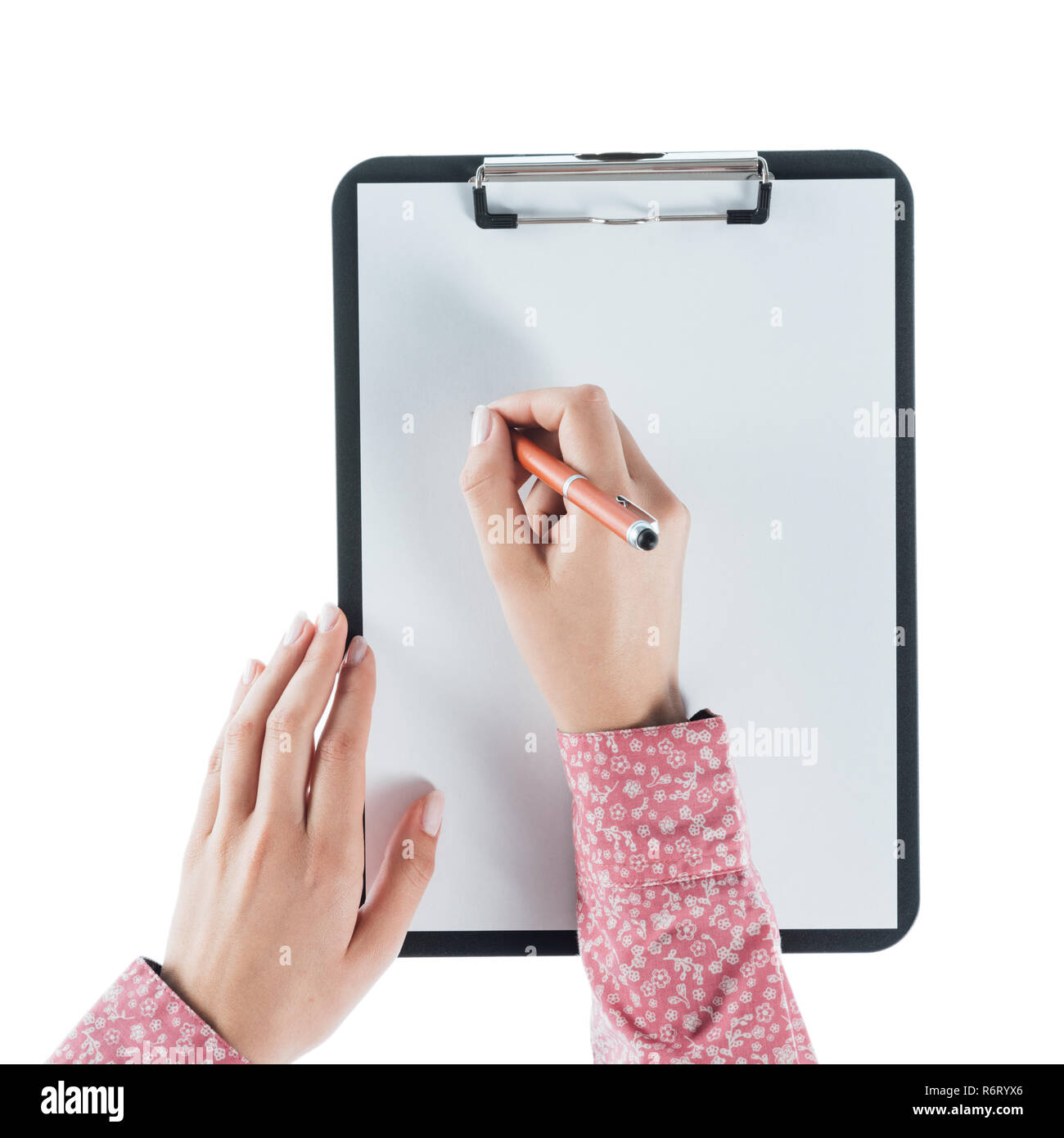 Woman writing on a clipboard Stock Photo