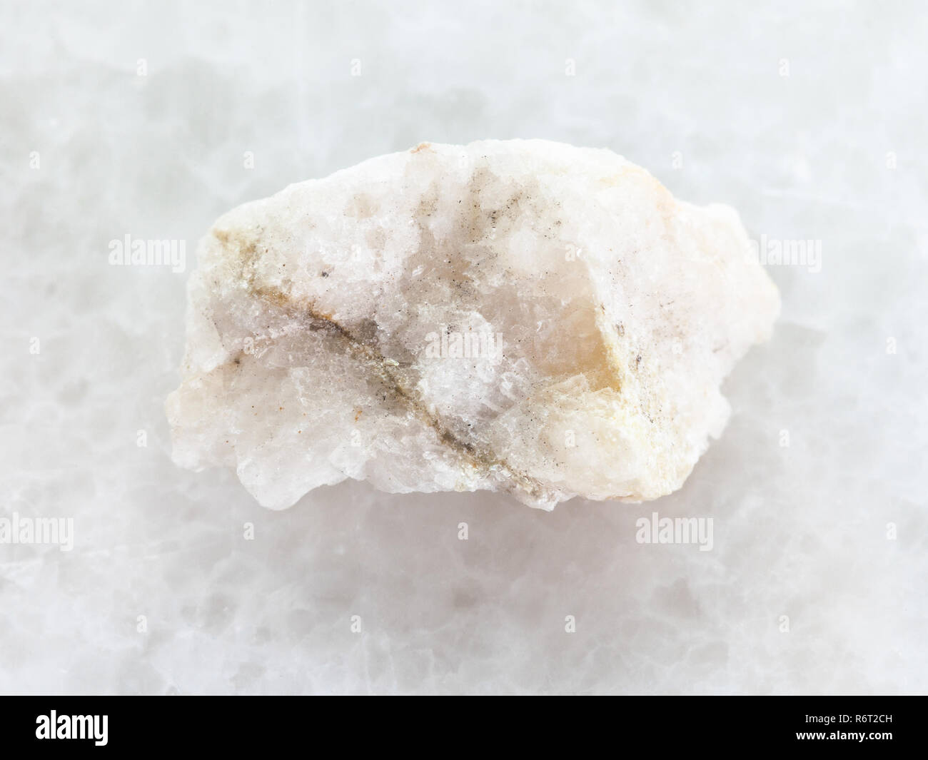 scheelite (tungsten ore) in rough stone on white Stock Photo Alamy