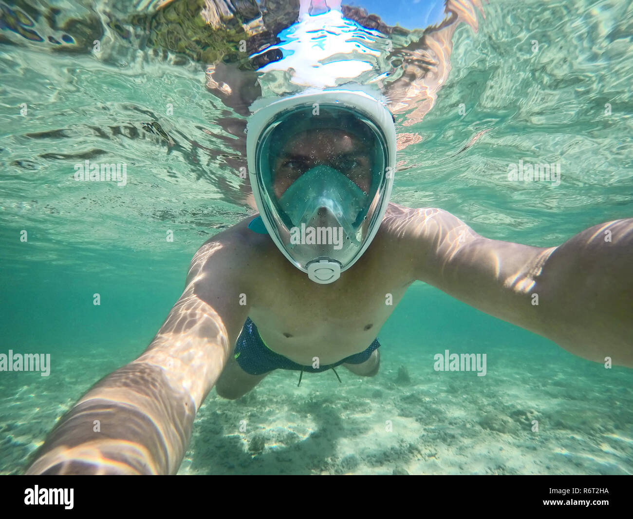 Young man snorkeling in Thailand Stock Photo
