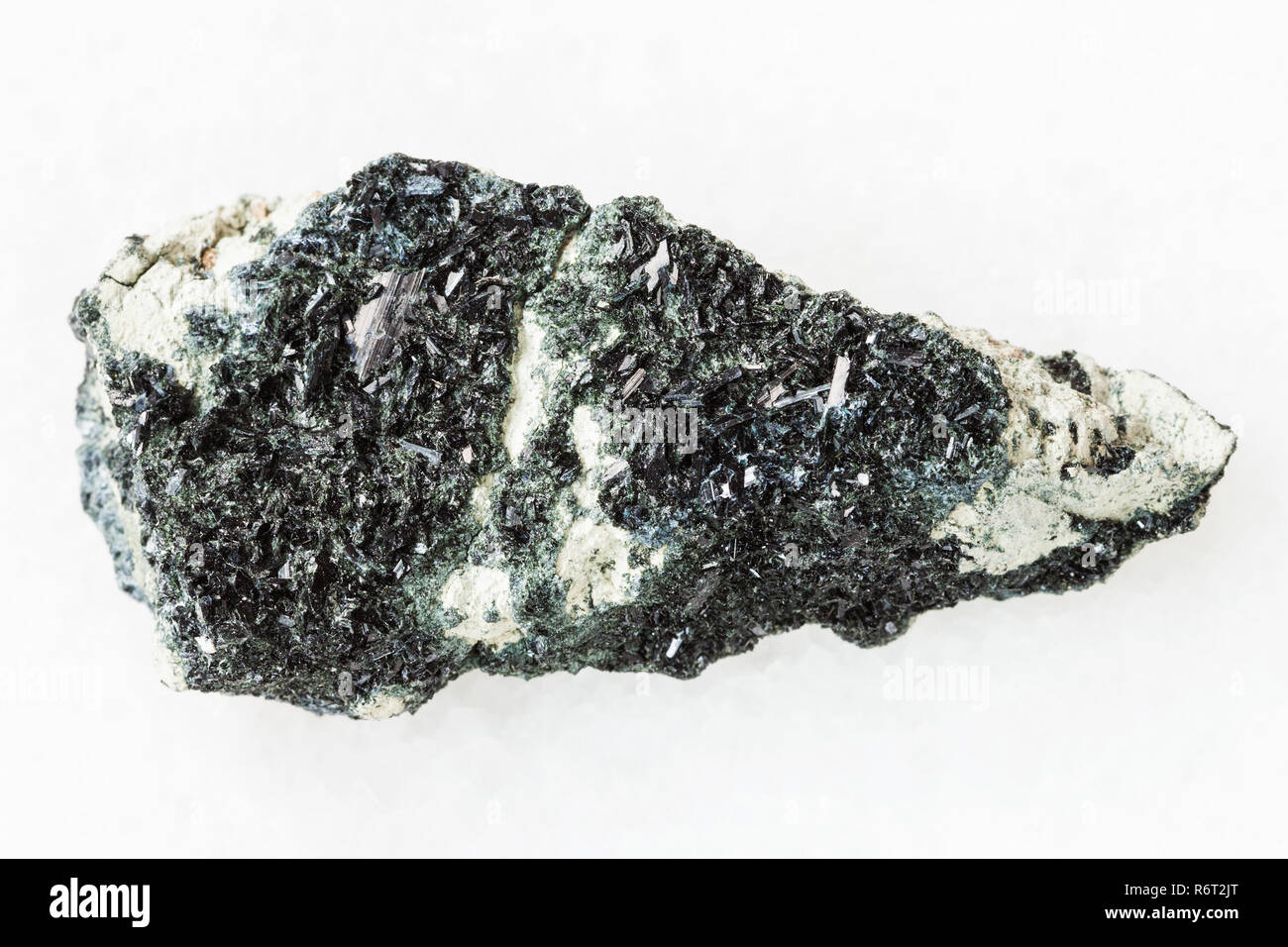 hornblende on amphibole-carbonate rock on white Stock Photo