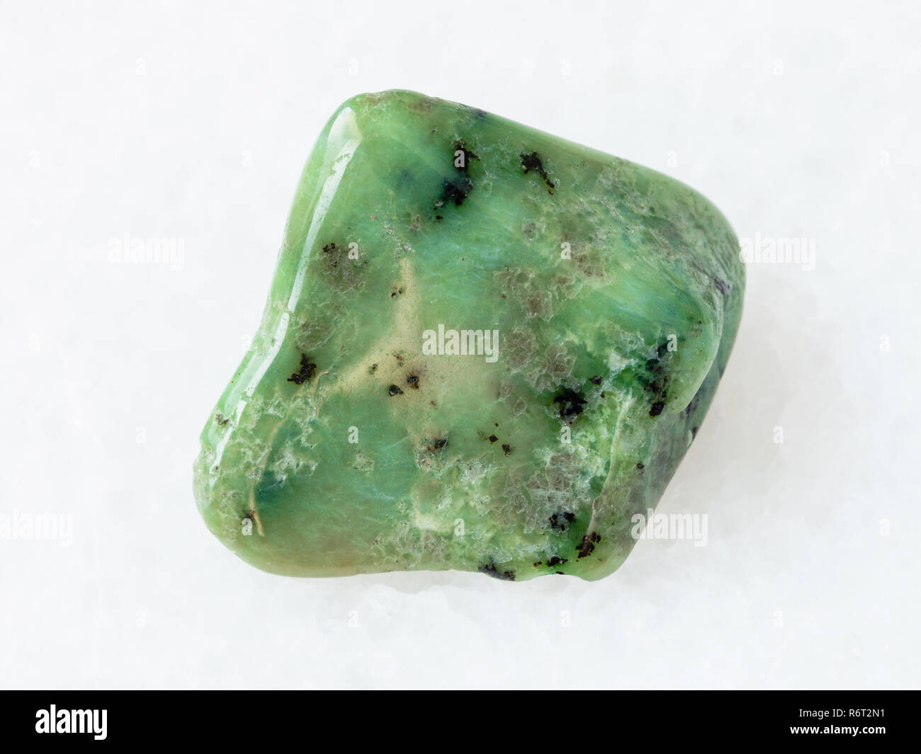 polished green Grossular garnet gemstone on white Stock Photo - Alamy