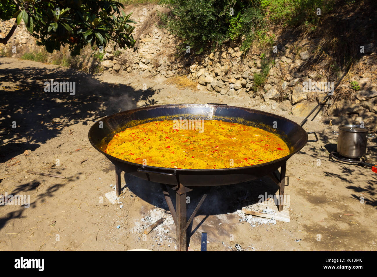 Paella being cooked on an Open Fire at a Village Fiesta in the  Almanzora Valley, Almeria province, Andalucía, Spain Stock Photo