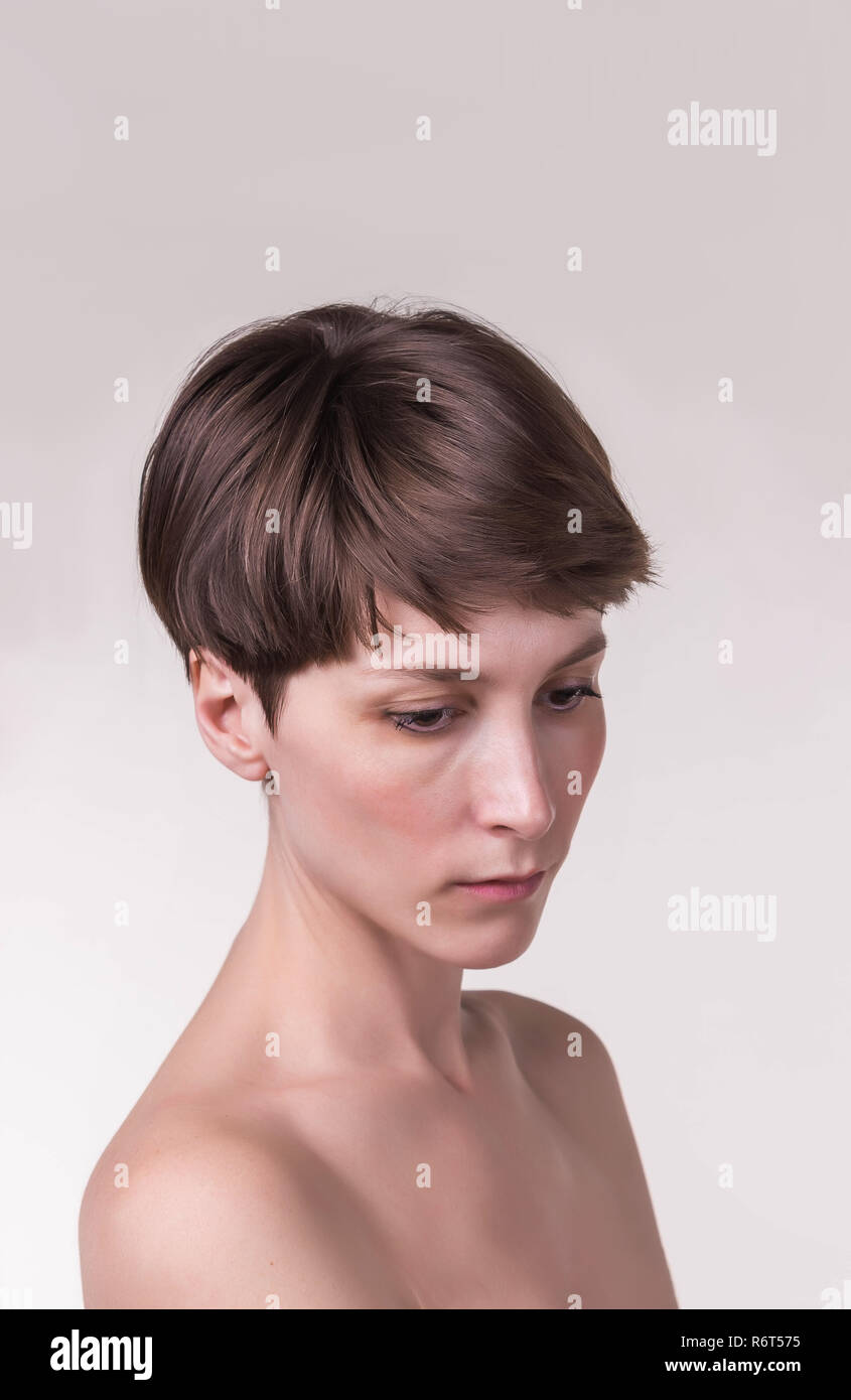 Beautiful female face close up. portrait of young model at studio on ...