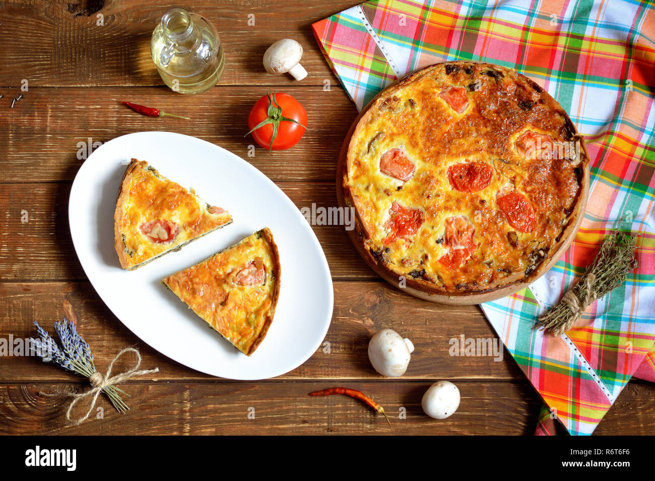 is a open-faced pastry with a filling of savoury custard with cheese, Spinach and mushrooms Stock Photo - Alamy