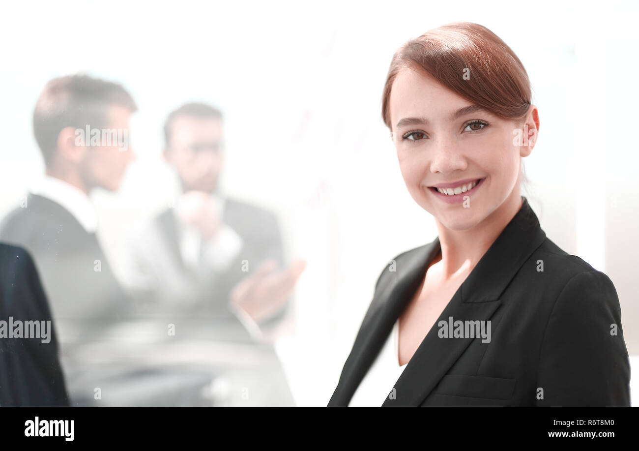 portrait of a young business woman on the background of the office ...