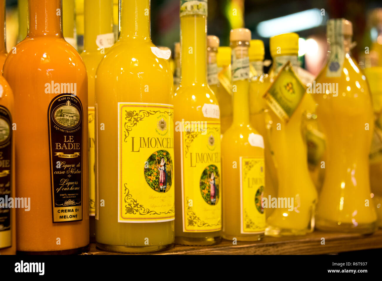 Horizontal close up of various Limoncello bottles in a shop. Stock Photo