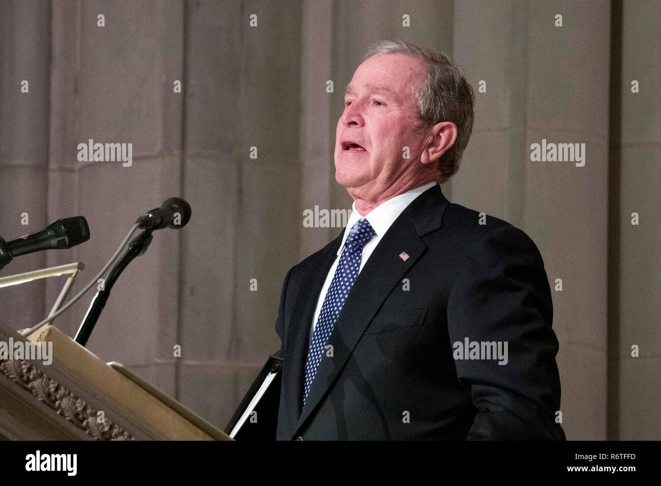 Former President George W. Bush fights back tears as he speaks during the  State Funeral for his father, former President George H.W. Bush, at the  National Cathedral, Wednesday, Dec. 5, 2018, in