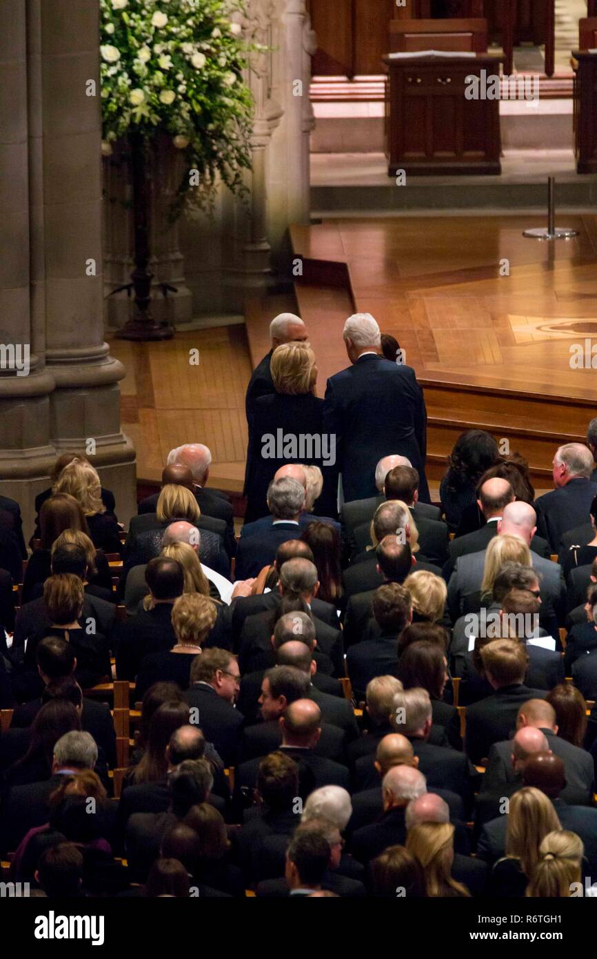 Washington DC, USA. 5th December, 2018. Former President Bill Clinton and Secretary of State Hillary Clinton chat with Vice President Mike Pence and Karen Pence before the start of the State Funeral for former U.S President George H.W. Bush at the National Cathedral December 5, 2018 in Washington, DC. Bush, the 41st President, died in his Houston home at age 94. Credit: Planetpix/Alamy Live News Stock Photo