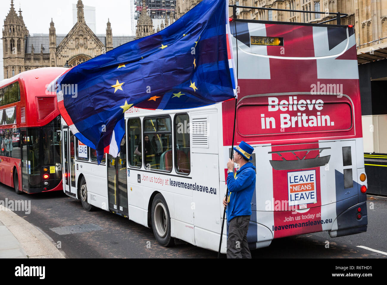 London, UK. 6th December, 2018. Steven Bray from pro-EU group SODEM (Stand of Defiance European Movement) stands next to a bus commissioned by Leave Means Leave as he protests outside Parliament while the House of Commons continues to debate Prime Minister Theresa May's proposal for the final Brexit agreement. Credit: Mark Kerrison/Alamy Live News Stock Photo