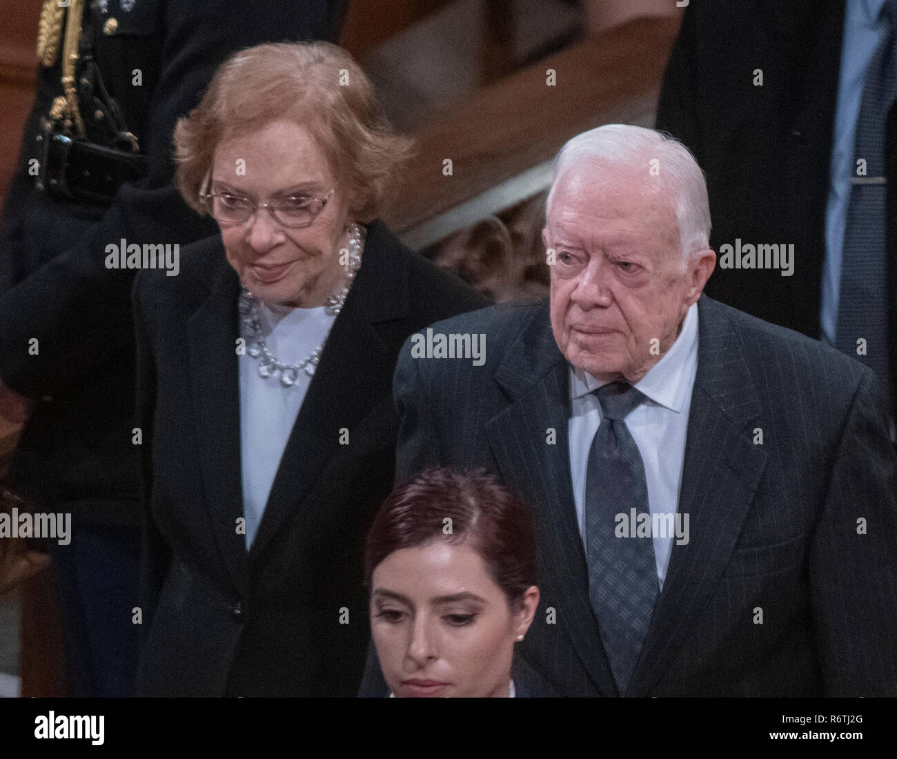Washington, United States Of America. 05th Dec, 2018. Former United States President Jimmy Carter, right, and former first lady Rosalynn Carter, left, depart following the National funeral service in honor of the late former US President George H.W. Bush at the Washington National Cathedral in Washington, DC on Wednesday, December 5, 2018. Credit: Ron Sachs/CNP (RESTRICTION: NO New York or New Jersey Newspapers or newspapers within a 75 mile radius of New York City) | usage worldwide Credit: dpa/Alamy Live News Stock Photo