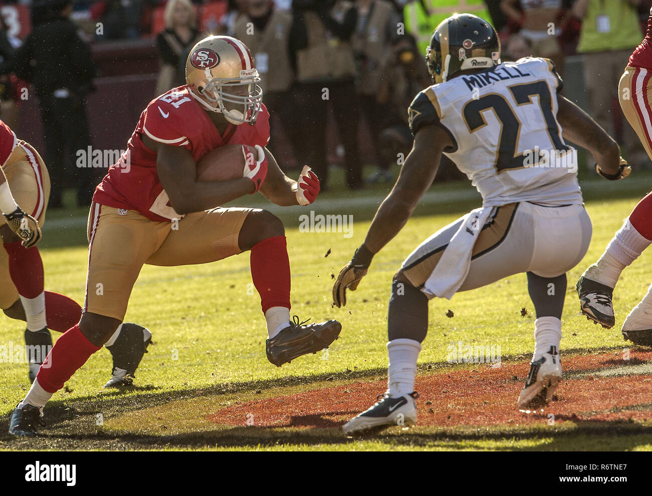 San Francisco, California, USA. 4th Dec, 2011. St. Louis Rams free safety  Quintin Mikell (27) attempts to strip ball from San Francisco 49ers tight  end Vernon Davis (85) on Sunday, December 4