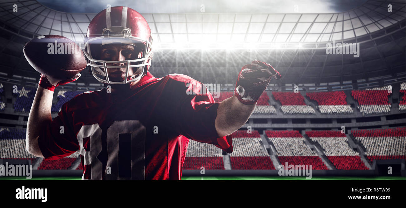 American football player standing with helmet preparing to throw ball