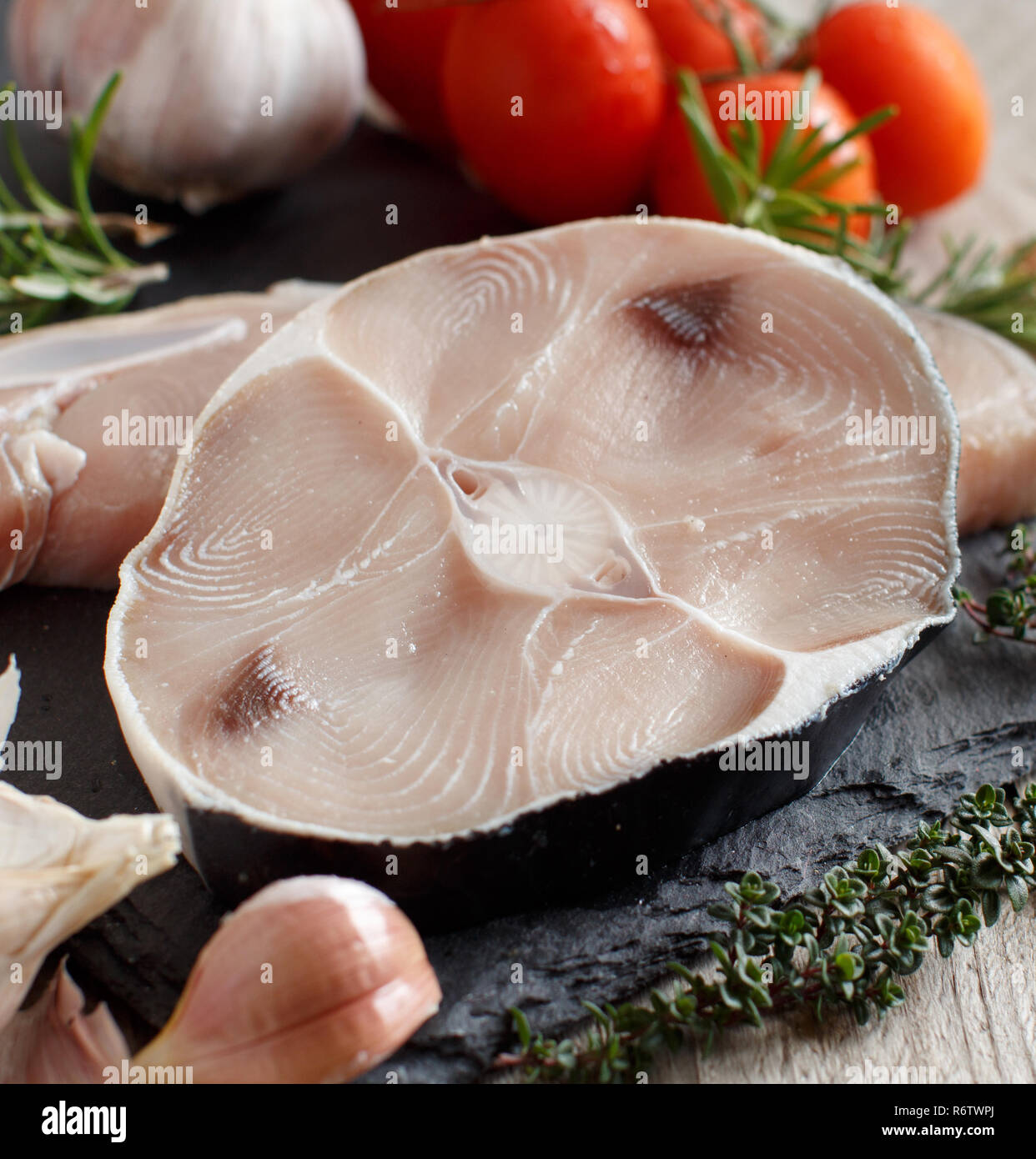Two shark steak with vegetables and herbs Stock Photo