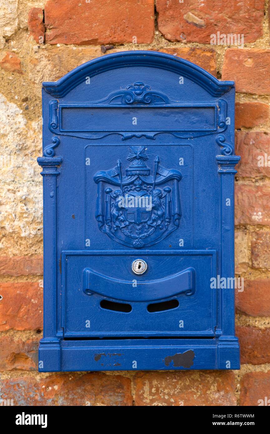 blue letterbox on a wall Stock Photo Alamy