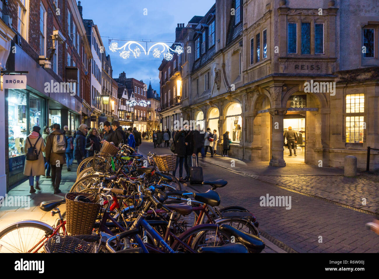 Shoppers in Trinity Street, Cambridge at dusk. Stock Photo