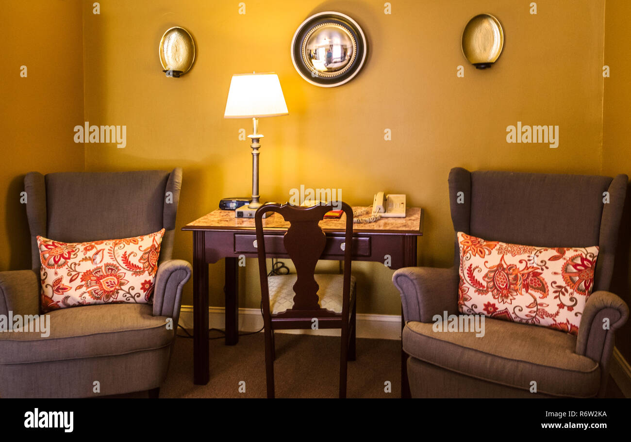 A sitting area provides a focal point in a newly-remodeled room at University Inn, a family-owned hotel near Emory University in Atlanta, Georgia. Stock Photo