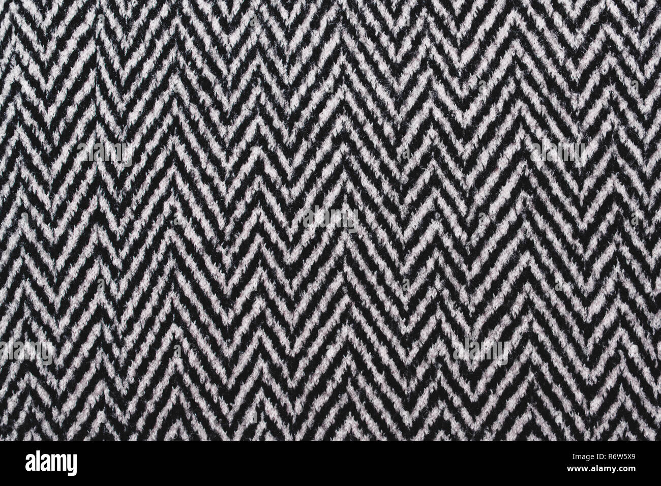 Herringbone Tweed coat background. Gray warm, soft wool fabric Stock Photo