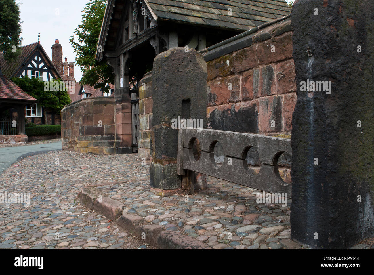Stocks for punishment at supers church Great Budworth, Cheshire Stock Photo
