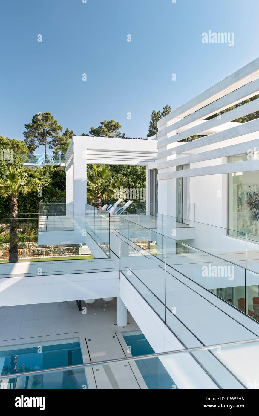 Shaded balcony seating and elevated double height walkway, new build