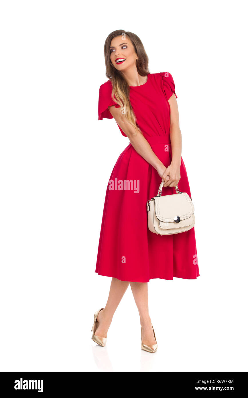 red dress with gold heels