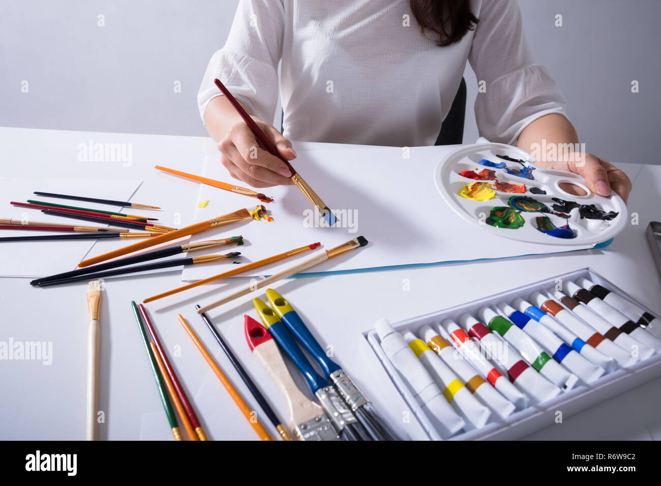 Female Artist Painting On Canvas Paper Stock Photo Alamy