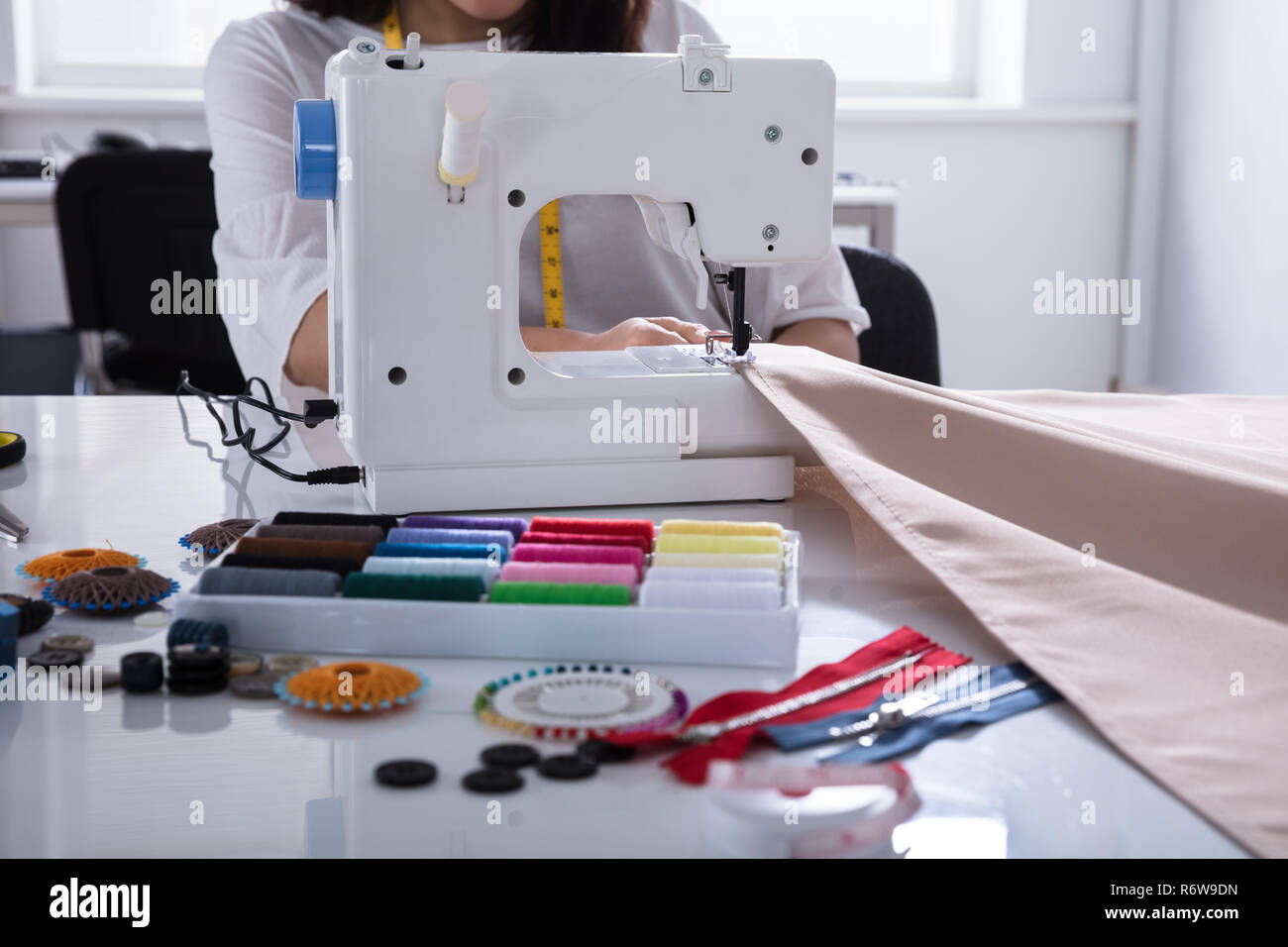 Fashion Designer Stitching Cloth On Sewing Machine Stock Photo - Alamy
