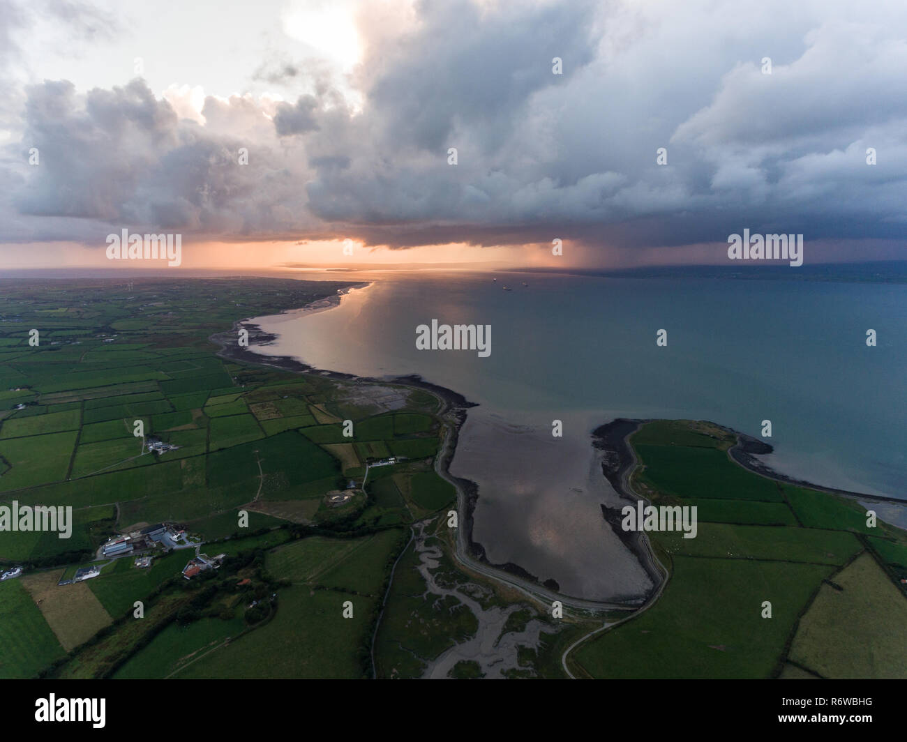 Aerial view at sunset of storm clouds on the west coast of Ireland ...