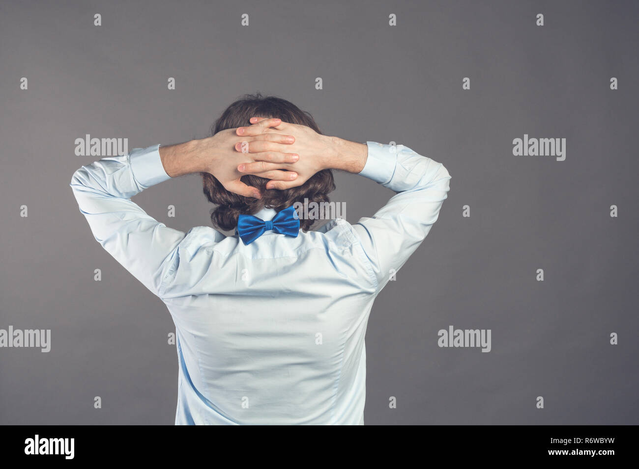 Arms crossed behind back hires stock photography and images Alamy
