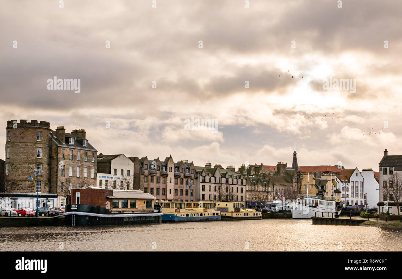 Houseboats, river barges and historic buildings in Winter, The Shore, Leith, Edinburgh, Scotland, UK Stock Photo