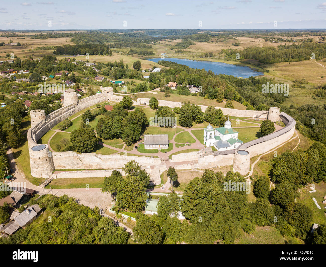 Izborsk medieval Russian fortress (kremlin) with a church. Aerial drone photo. Near Pskov, Russia. Birds eye view Stock Photo