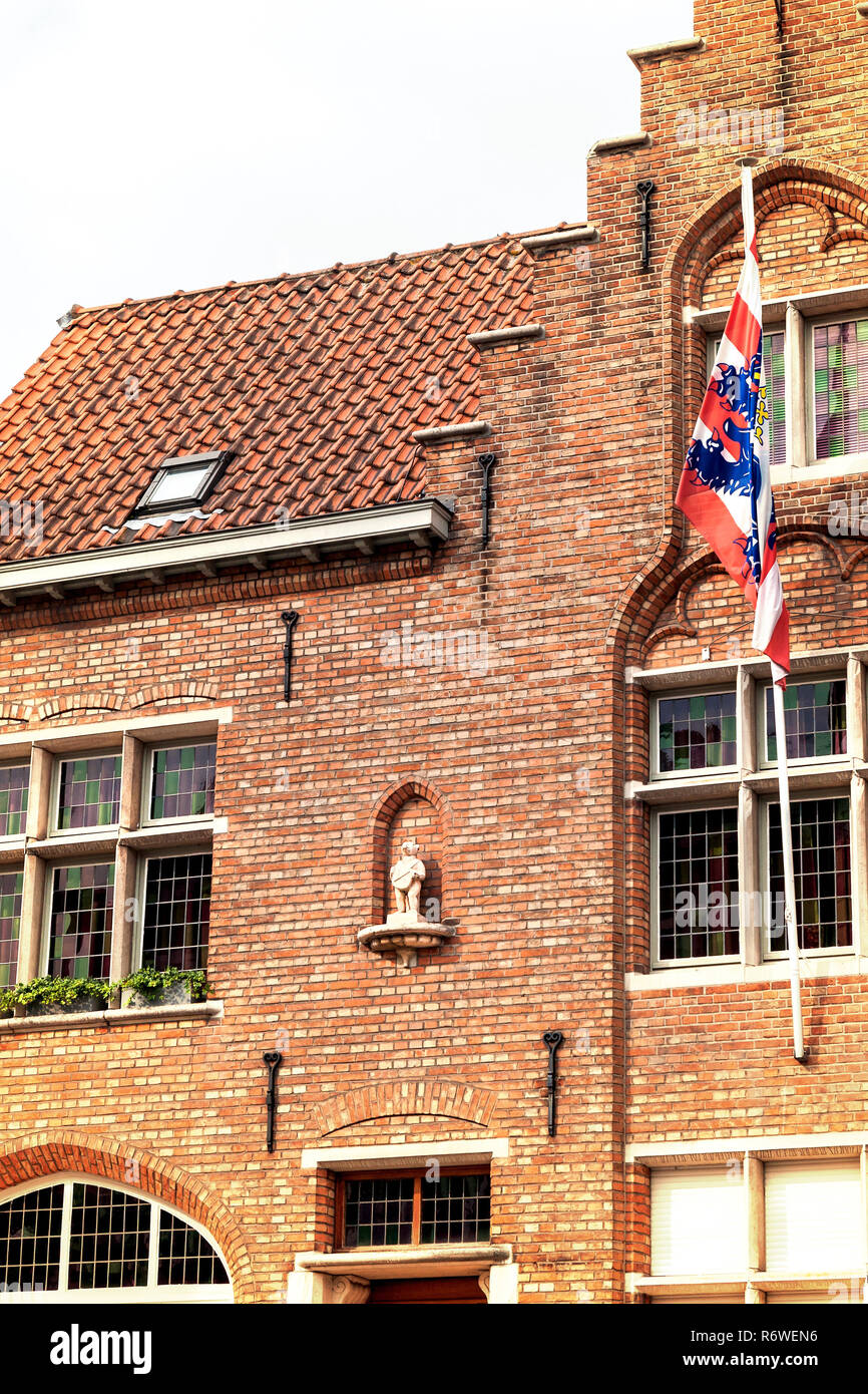 bruges city symbol,the brugs beertje on the facade of the poortersloge Stock Photo