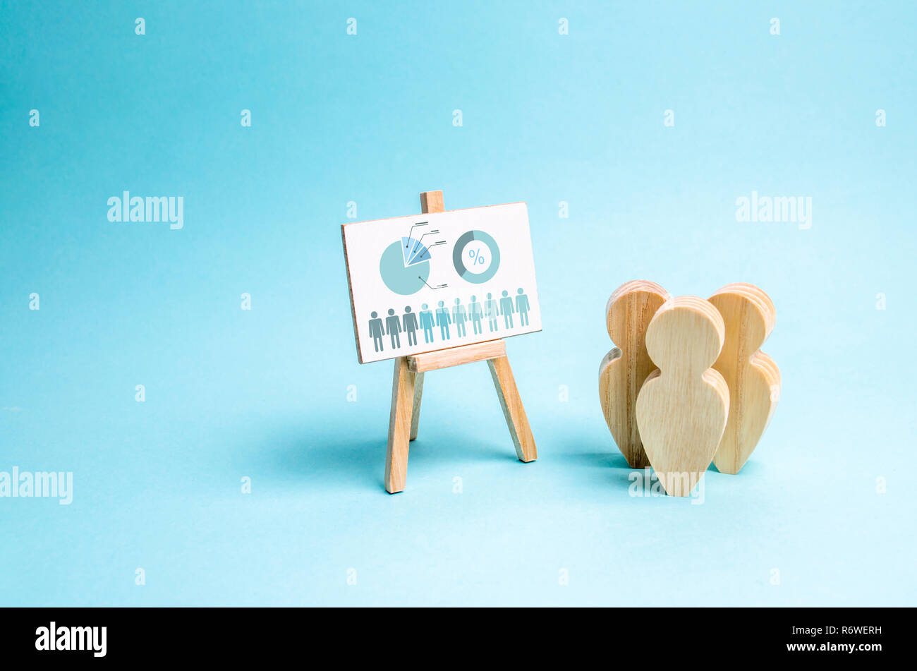 People stand near the canvas with graphs and reports. Business report, summary and planning. Market research and analysis. Concept of business process Stock Photo
