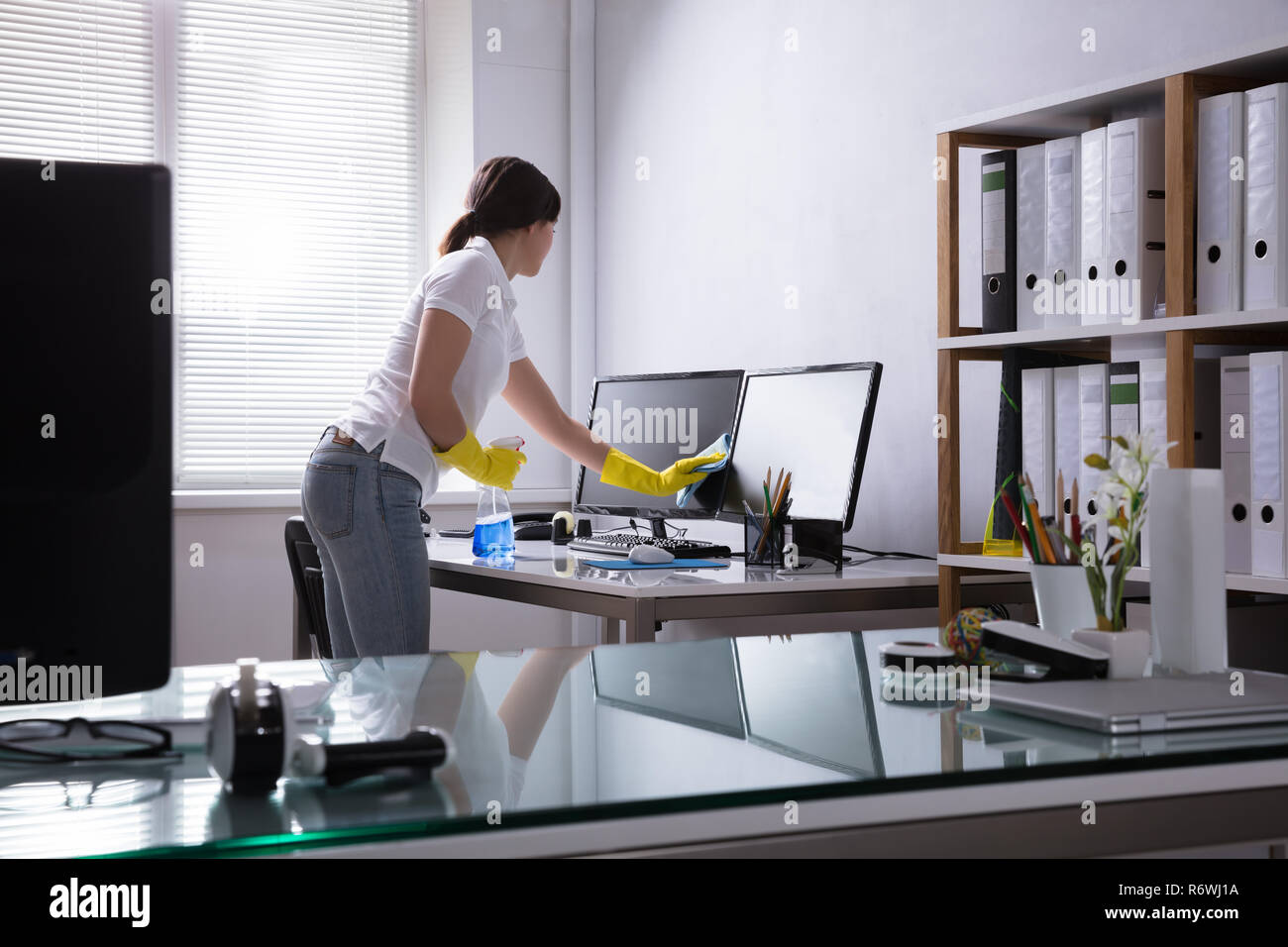 Woman wiping screen computer hi-res stock photography and images - Alamy