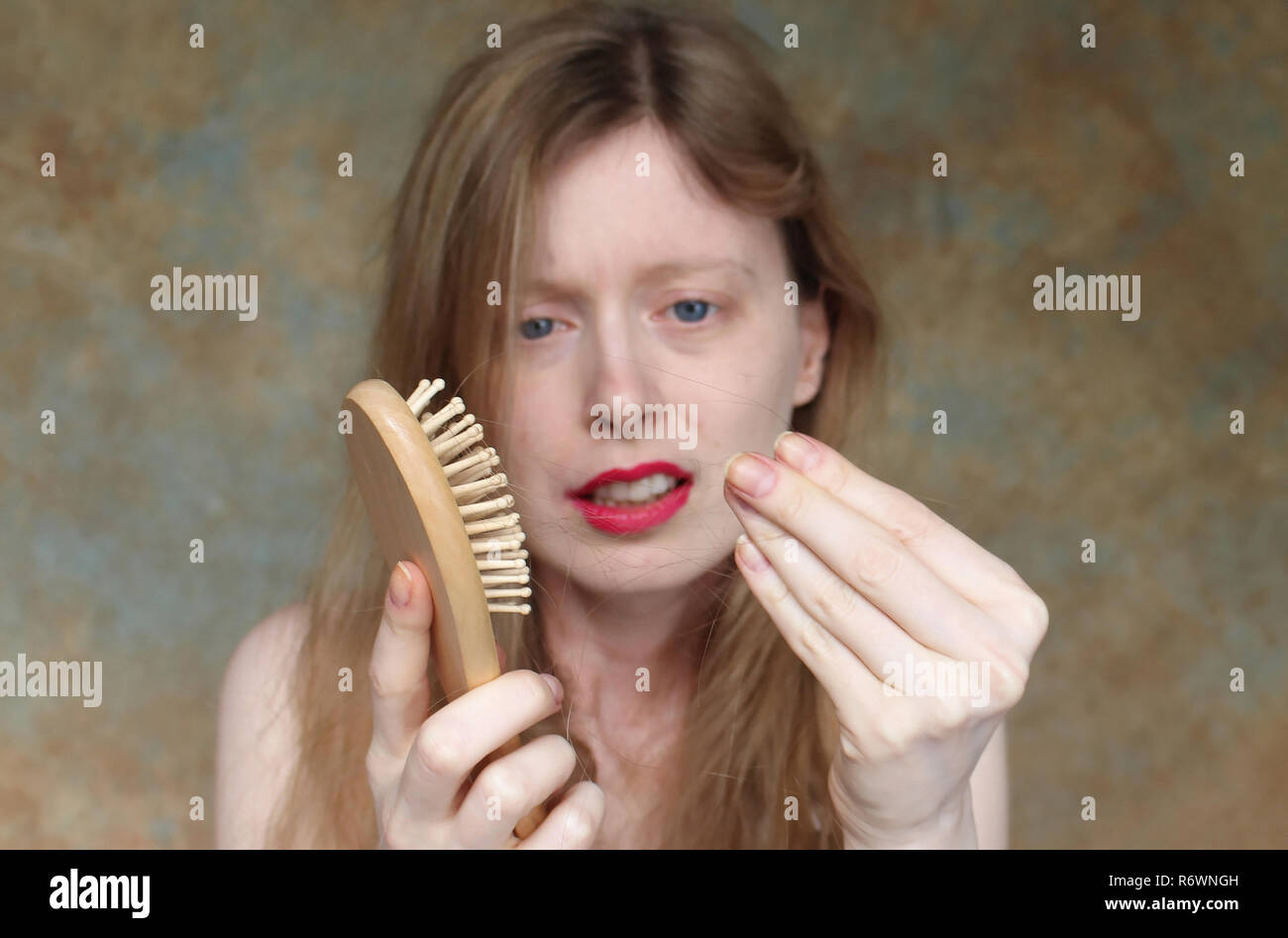 Upset about hair falling out Stock Photo Alamy