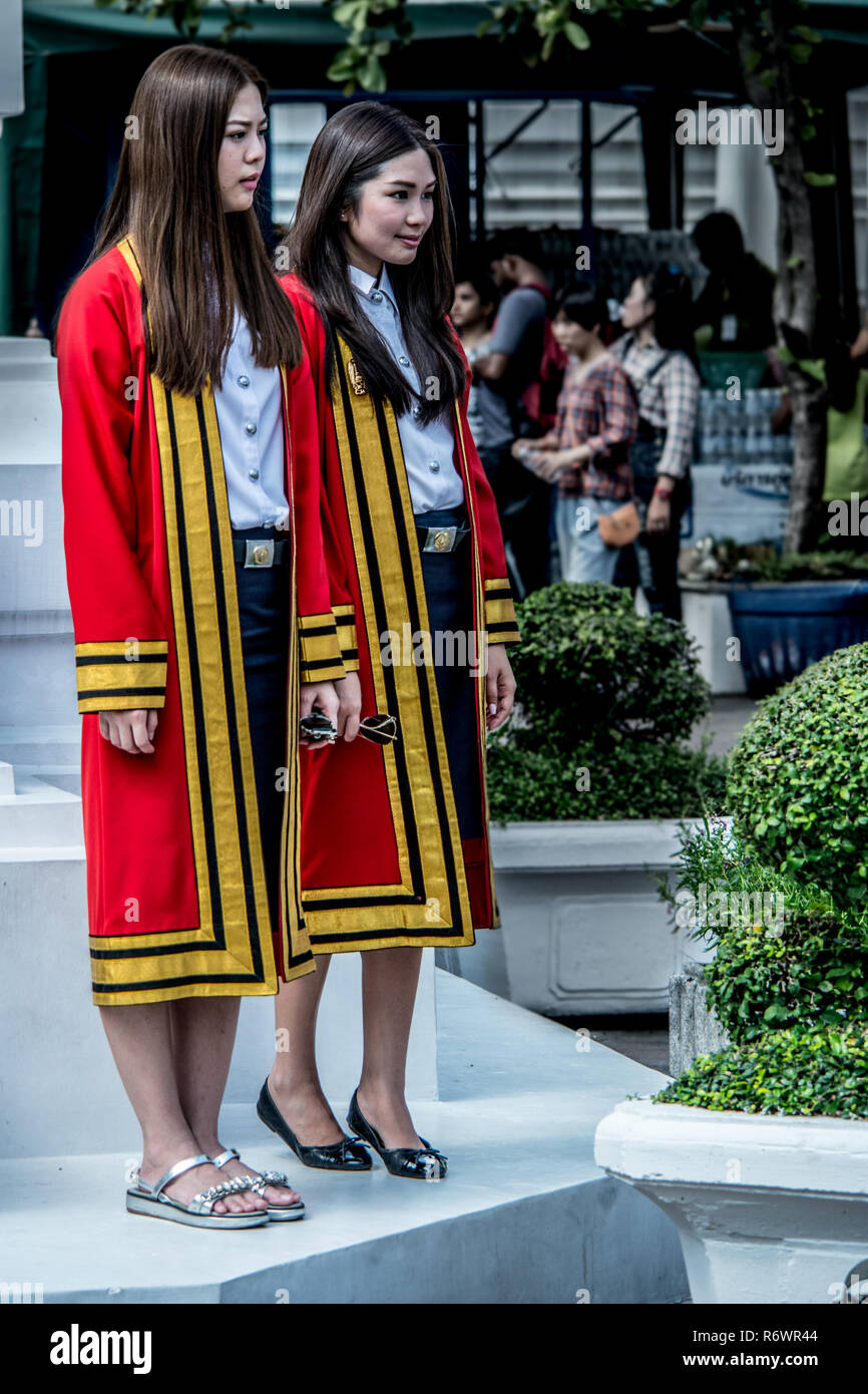 Two Thai women pose for photos and celebrate their university graduation, Bangkok, Thailand. Stock Photo