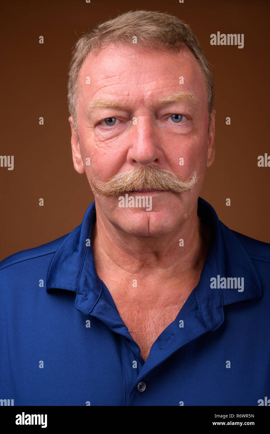 Face of handsome senior man with mustache Stock Photo