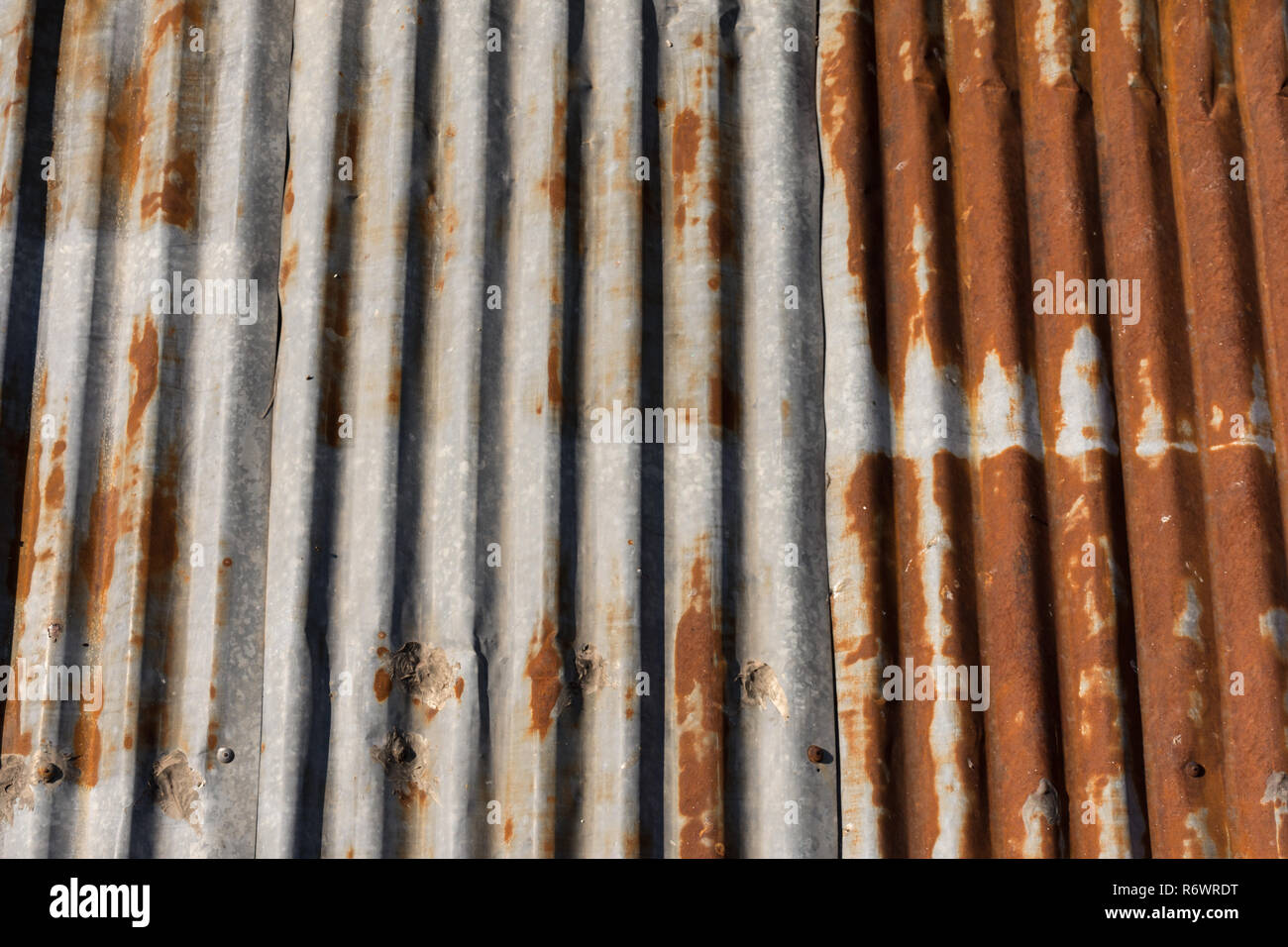 Close up of a rusty weathered corrugated metal roof. Stock Photo