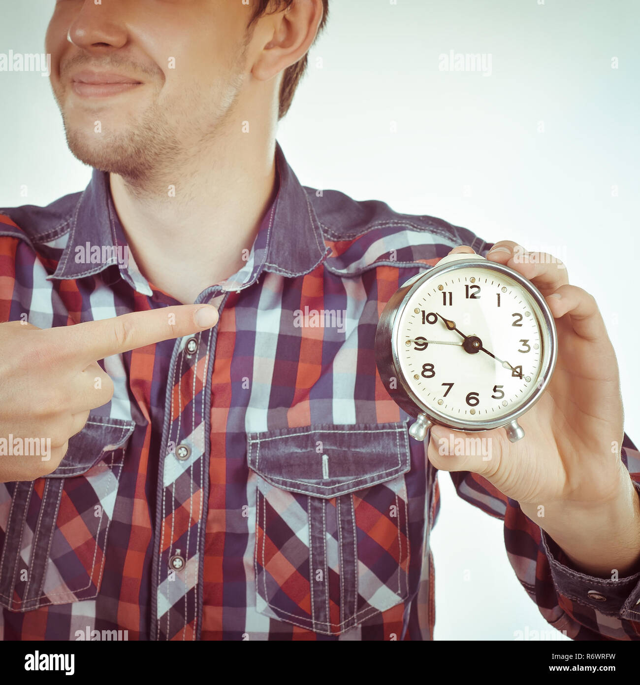 Man with clock hi-res stock photography and images - Alamy