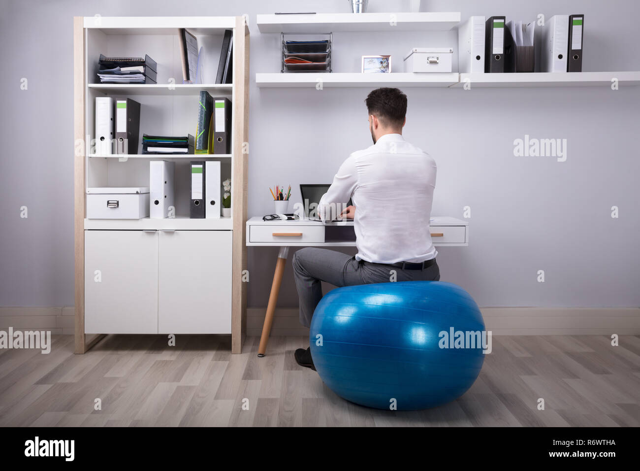 Exercise ball desk man hires stock photography and images Alamy