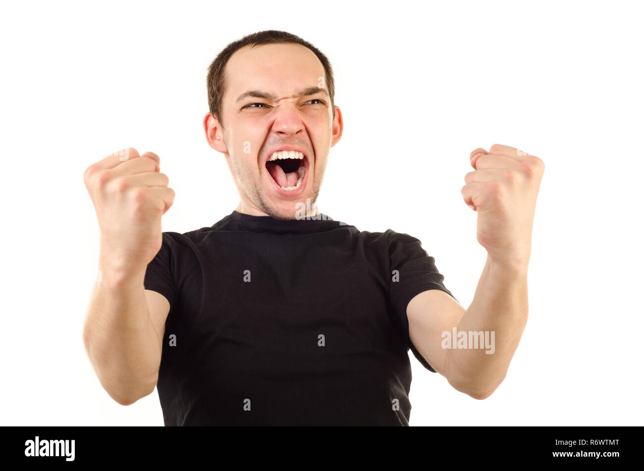 Young adult man cheering win hi-res stock photography and images - Alamy