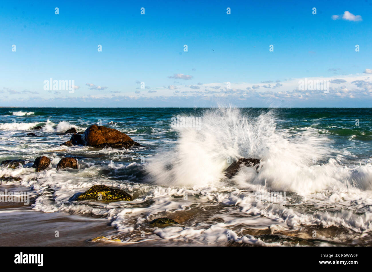 storm at sea waves break on the stones splashing water Stock Photo - Alamy