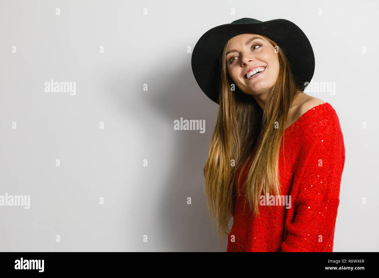 Woman wearing red sweater hi-res stock photography and images - Alamy