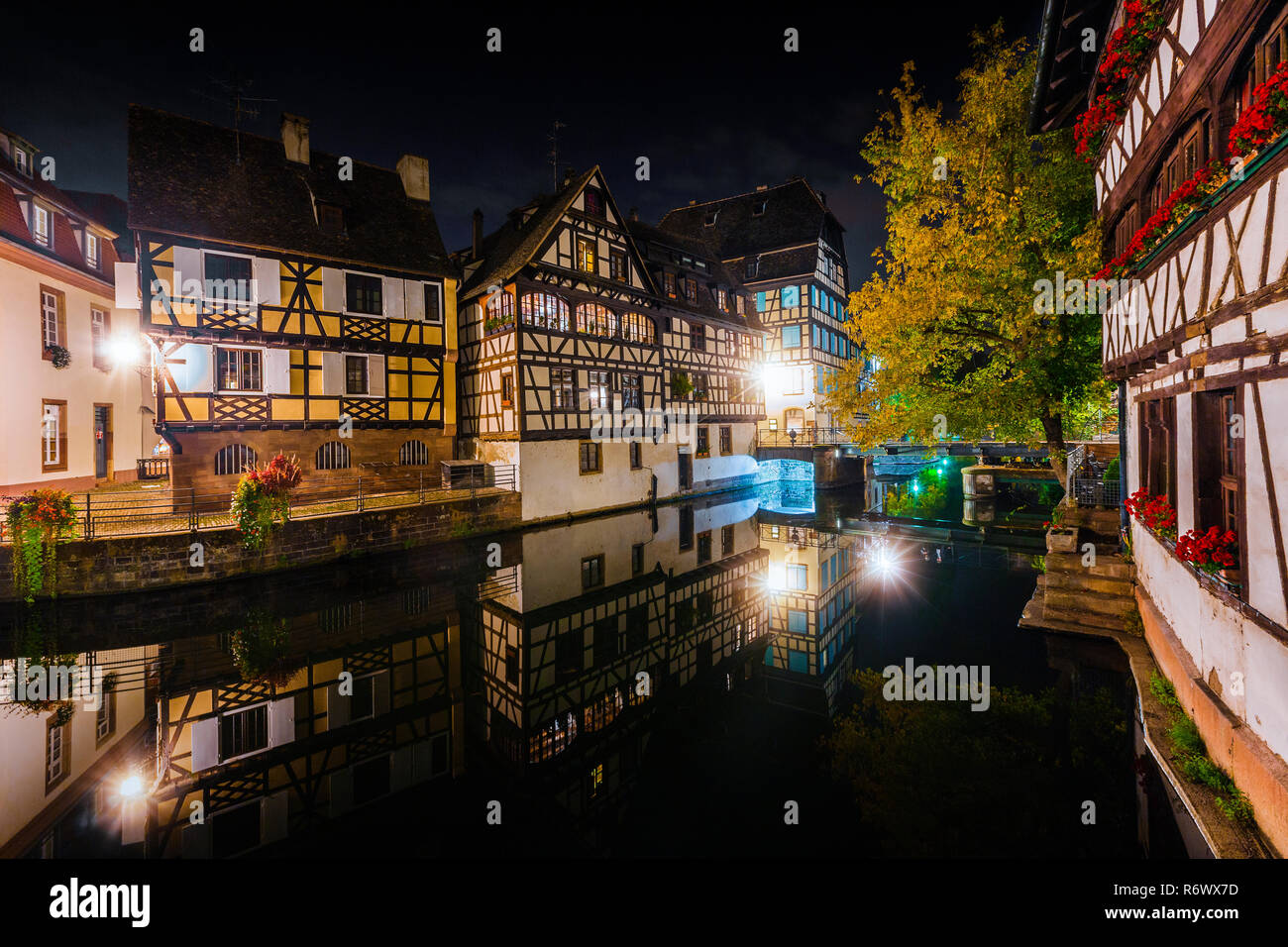 Historic half-timbered houses in tanners quarter in district la petite france in Strasbourg at night, Alsace, France Stock Photo
