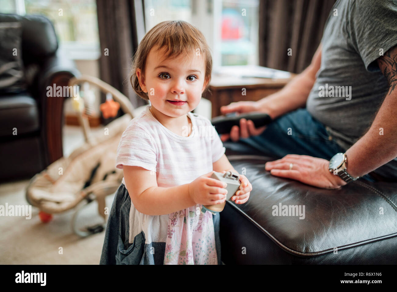 Happy Little girl with her Toy Stock Photo - Alamy