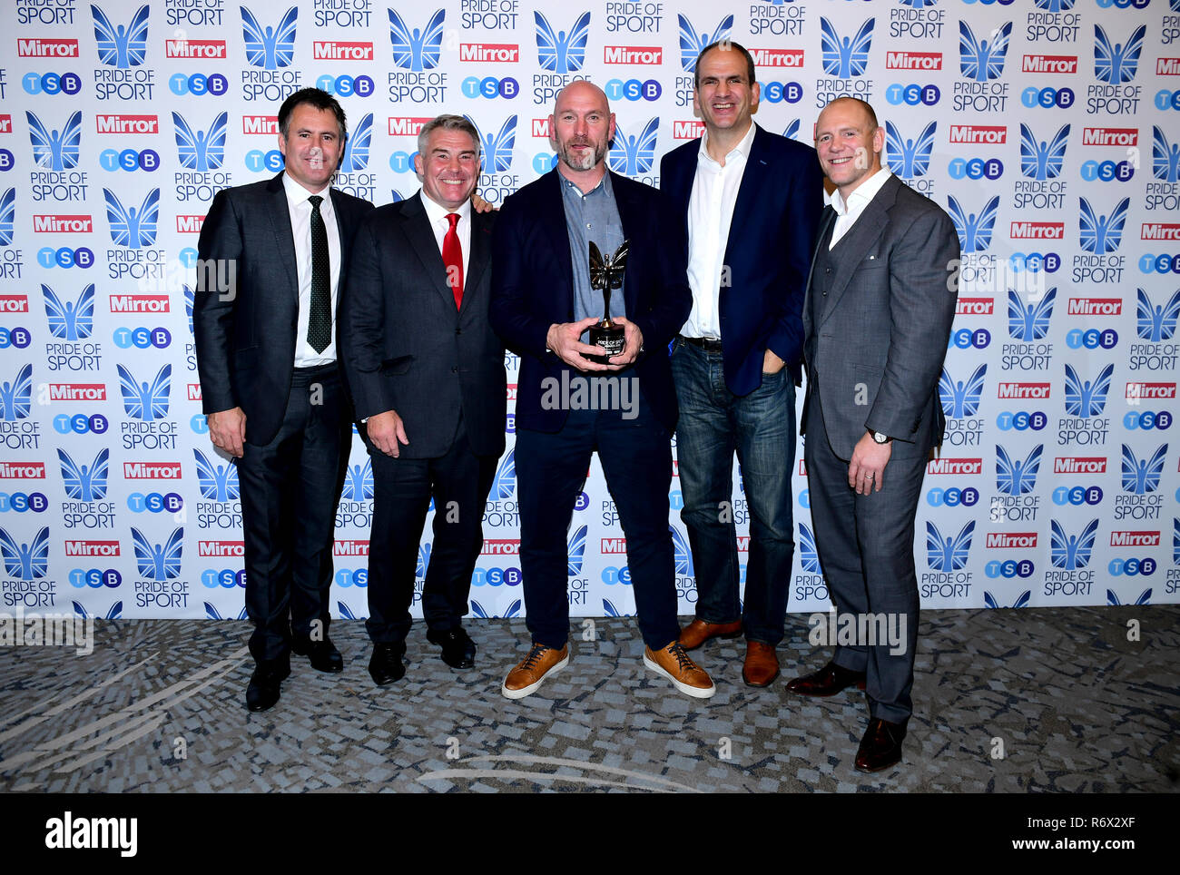 Kenny Logan (left), Jason Leonard (second left), Martin Johnson (second right) and Mike Tindall (right) present Lawrence Dallaglio (centre) with his Lifetime Achievment Award at the Pride of Sport Awards 2018 at the Grosvenor House hotel, London. Stock Photo
