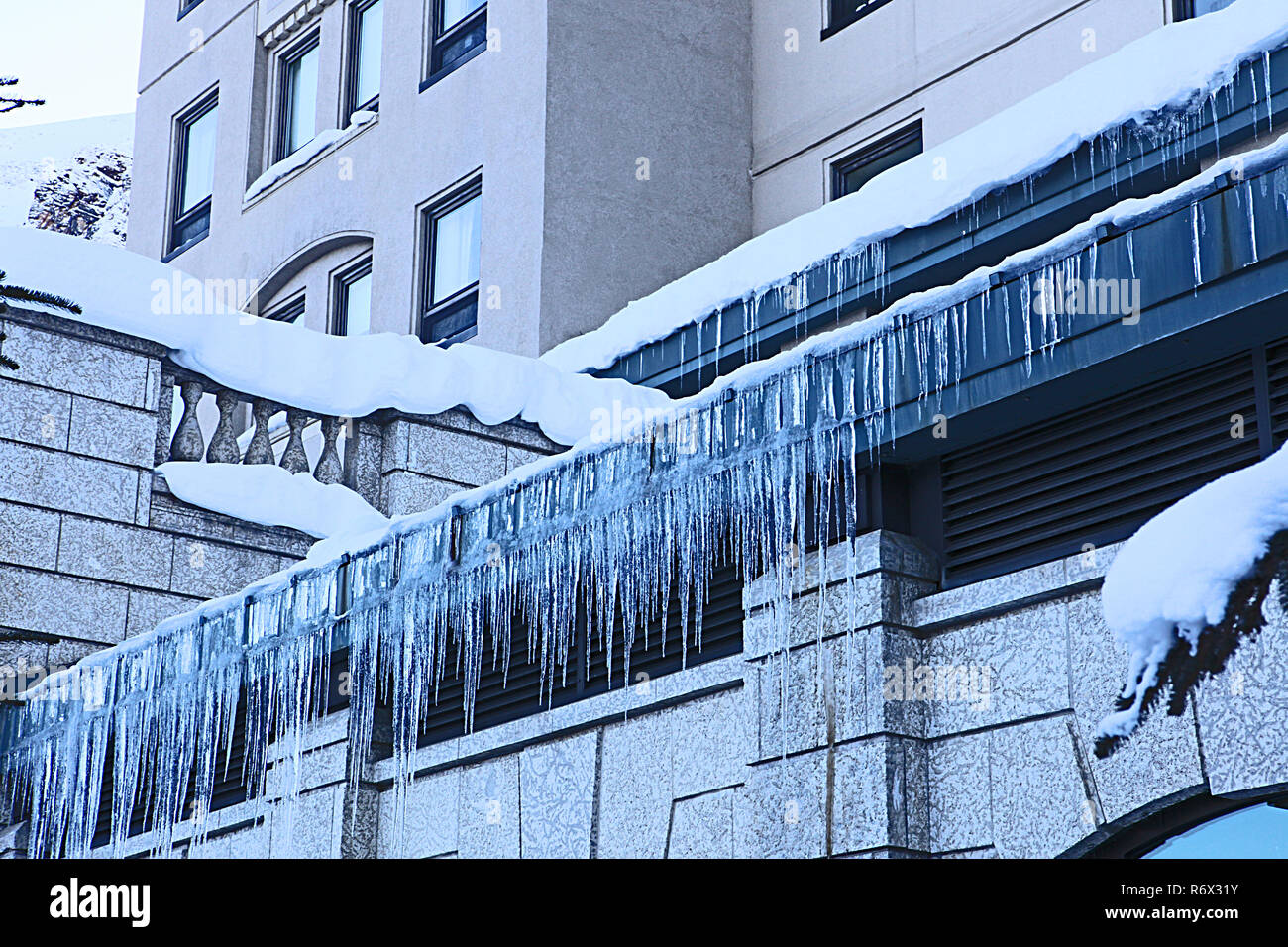 Icicles form the roof of Chateau Lake Louise Stock Photo