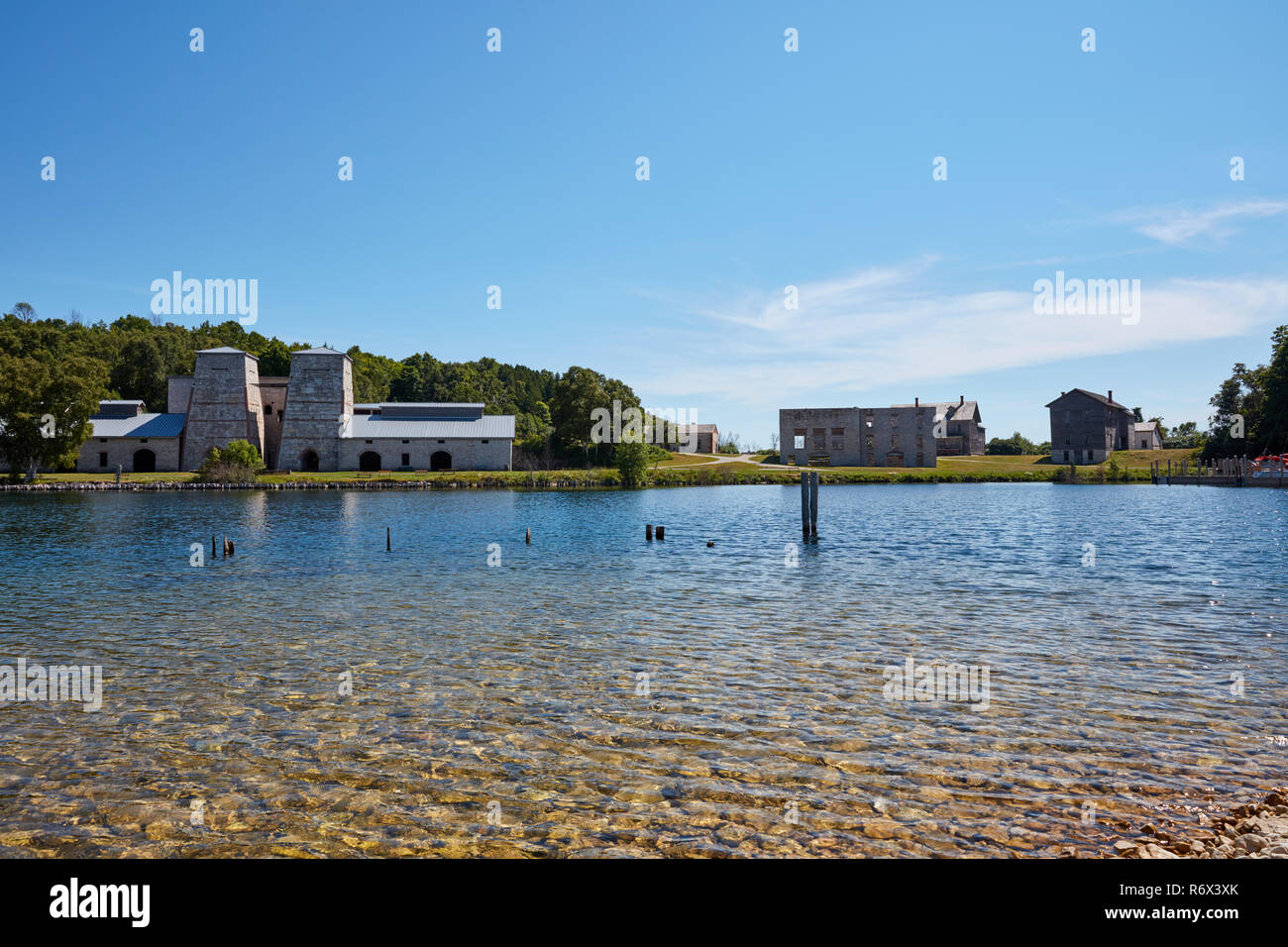 The Furnace and Company Store building ruins seen across the harbor in Fayette Historic State Park, Michigan Stock Photo