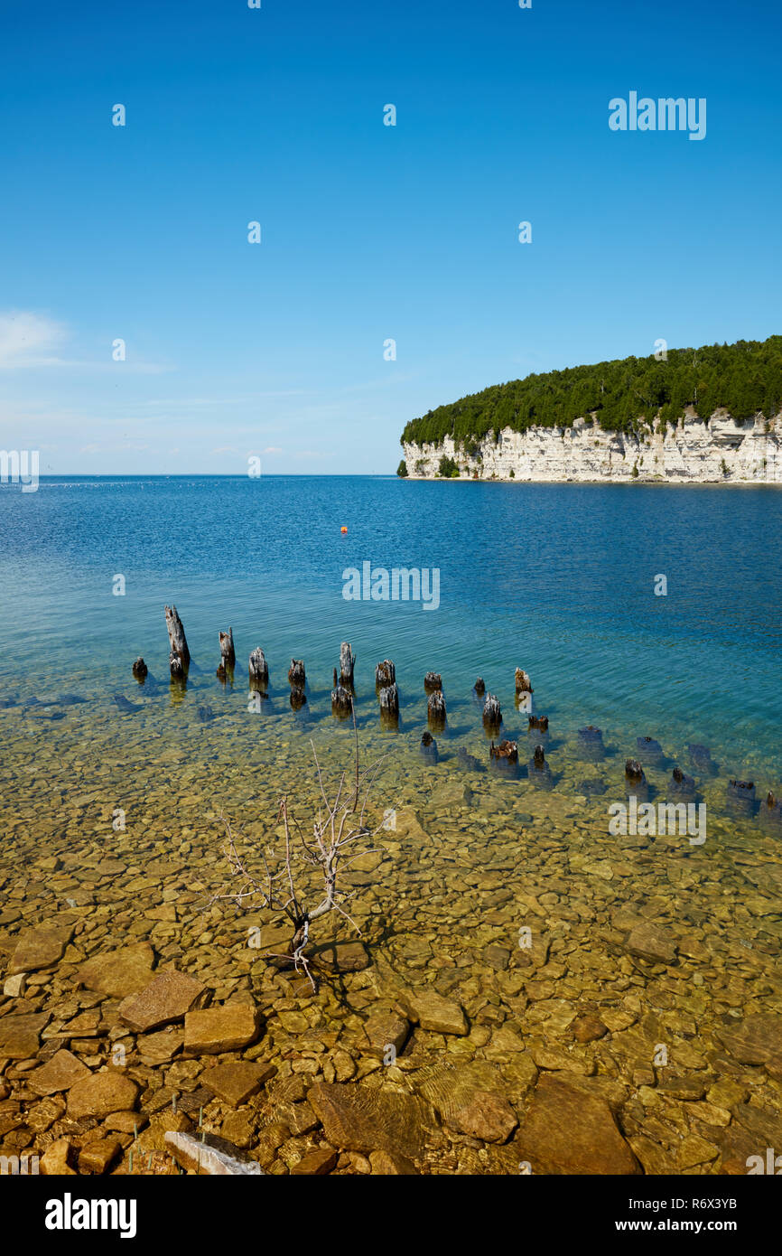 Remains of a dock in the harbor of the historic ghost town of Fayette, Michigan Stock Photo